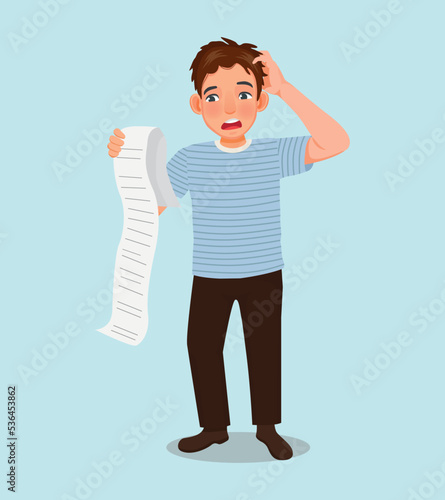 Young man worker shocked and feeling worries when seeing long list of bills need to pay