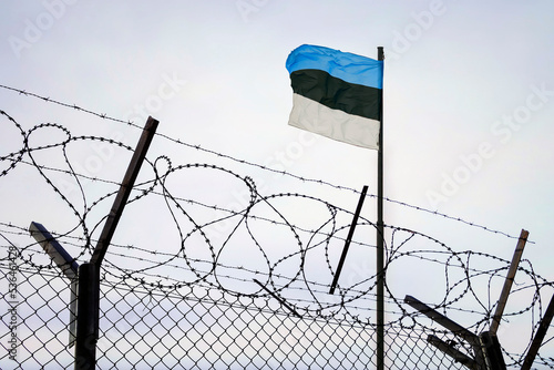 estonian Russian border. Concept of estonia closed borders with flag and wire fence. Ukraine immigration and homeland security. photo