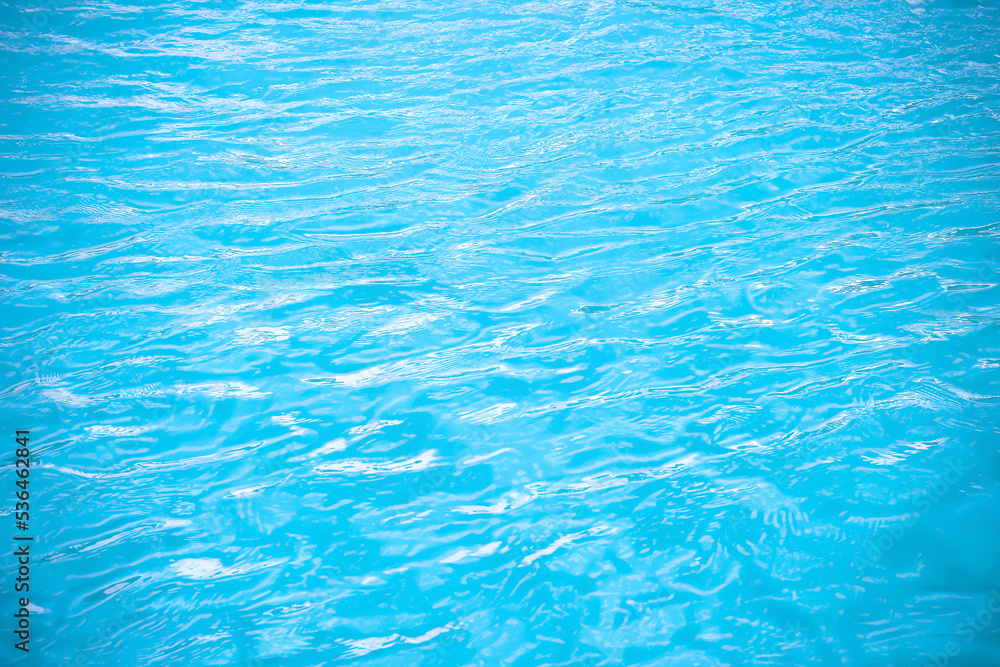 Summer water ripple in swimming pool abstract blue background Summer water ripple in swimming pool abstract blue background