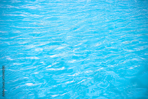 Summer water ripple in swimming pool abstract blue background