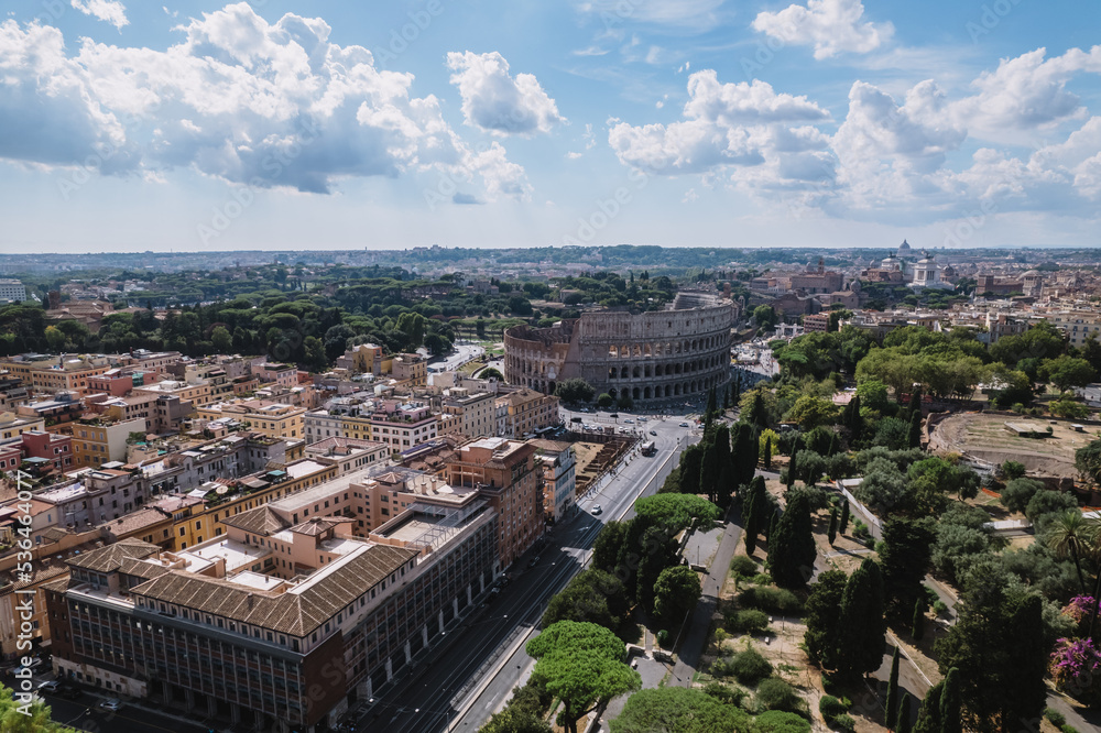 Obraz premium The Colosseum and the Imperial Forums in Rome beautiful aerial shot around the Colosseum.