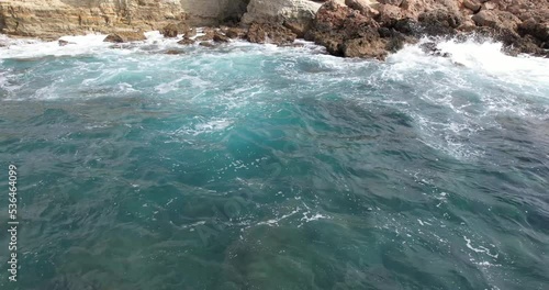 Mediterranean waves crash on the rocky shore in Cyprus