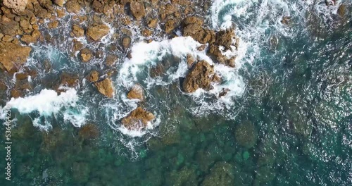 Aerial view to the sea waves. blue background