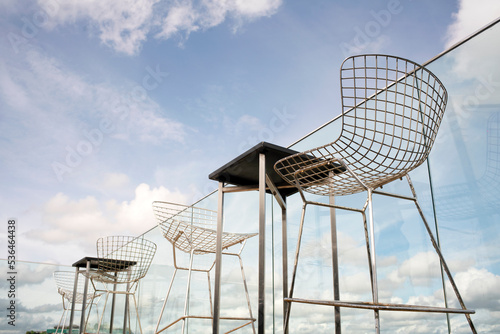 Chairs and Stools Bar with Blue Sky for nature background.