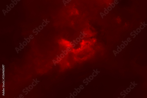 Red night sky background. Blurred photo of dark red sky. Photo can be used for the concept of Halloween and galaxy space background. 