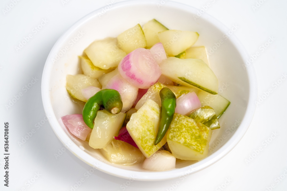 Typical Indonesian cucumber pickle, usually cucumber cut into squares with the addition of shallots and whole cayenne pepper
Typical Indonesian cucumber pickle, usually cucumber cut into squares with the addition of shallots and whole cayenne pepper