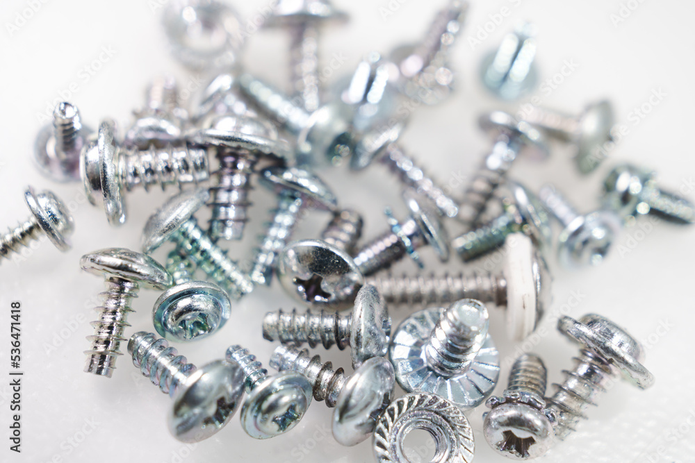 Screws, self-tapping, bolts on a white background. Screws, self-tapping, bolts on a white background.