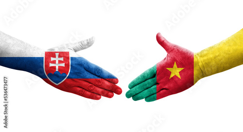 Handshake between Cameroon and Slovakia flags painted on hands, isolated transparent image.