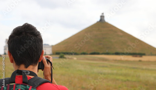 Waterloo, W, Belgium - August 17, 2022: Memorial with Lion on the hill and Photographer