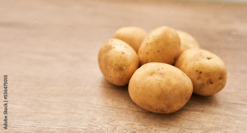 group of fresh round potato on wood table food background group of fresh round potato on wood table food background