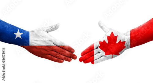 Handshake between Canada and Chile flags painted on hands, isolated transparent image.
