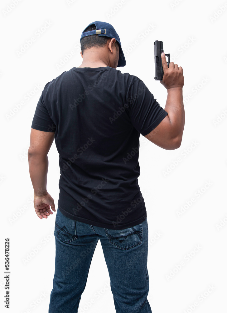 Behind the scenes Burglar or terrorist. Holding a pistol in various poses on isolated background with clipping path. Behind the scenes Burglar or terrorist. Holding a pistol in various poses on isolated background with clipping path.