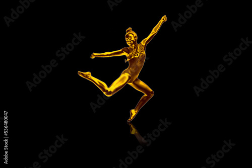 Girl gymnastics Jumping in gold