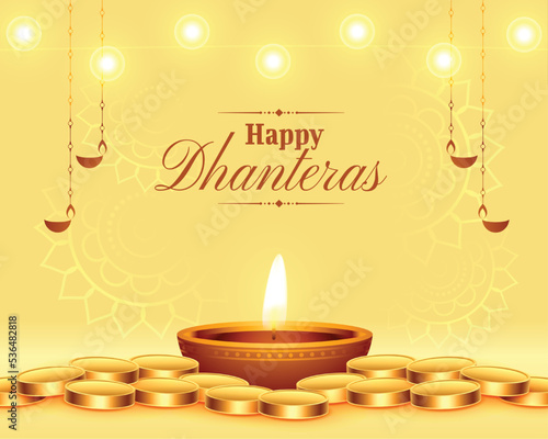 glowing diya with golden coin for dhanteras festival background photo