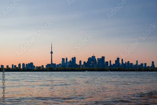 Сityscape - skyscrapers, houses, business centers - on the shore of the lake. city ​​reflection, blue water and park, Toronto, Ontario, 