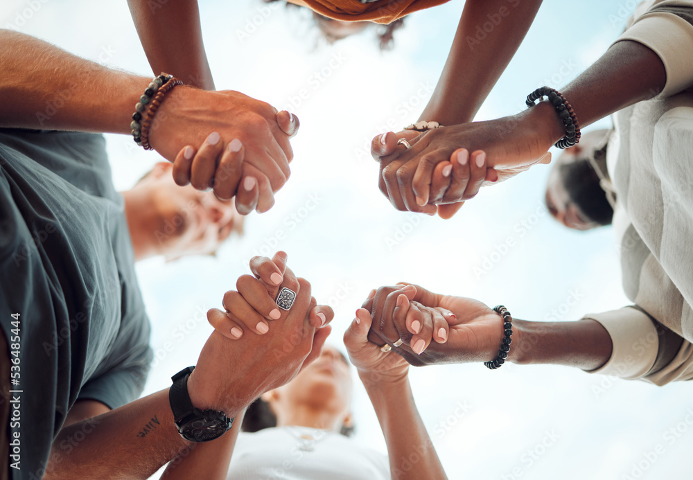Holding hands, support and friends praying for spiritual growth, community and gratitude together with sky from below. Group of people in partnership for hope, love and human faith in connection - obrazy, fototapety, plakaty 