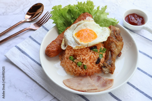 Fried rice Thai Style Served fried Chicken, Sausage ,Ham and Fried Egg - In Thai called American fried rice 