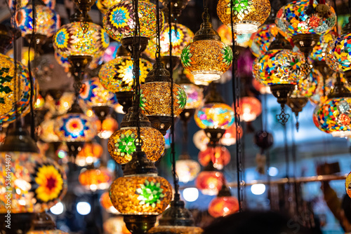 Colorful hanging lights from turkey on display for sale in Diwali fair to brighten the rooms. Artistic selective focus background.