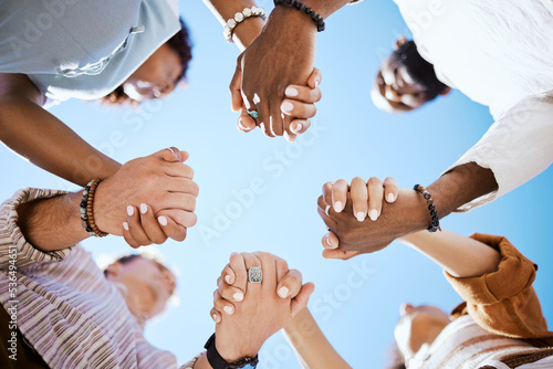 Canvas Print Diversity, support and people holding hands in trust and unity for community against sky background