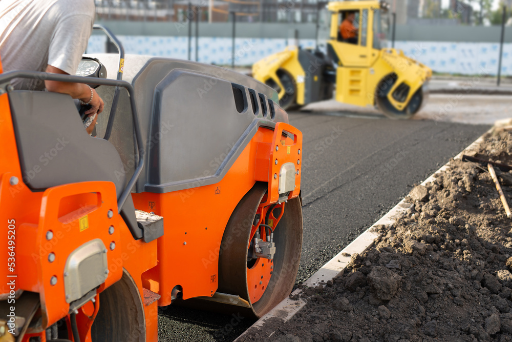 Road construction, asphalt concrete roller presses hot asphalt. A device for laying asphalt.