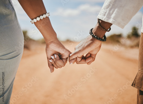 Tableau sur toile Couple walking, promise and hook fingers for support, trust and love in nature outdoors