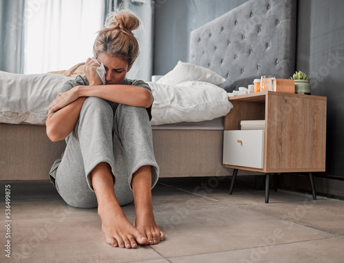 Slika na platnu Crying, sad and depressed woman on bedroom floor using wipe for tears struggling with mental health, depression and anxiety after heartbreak or breakup