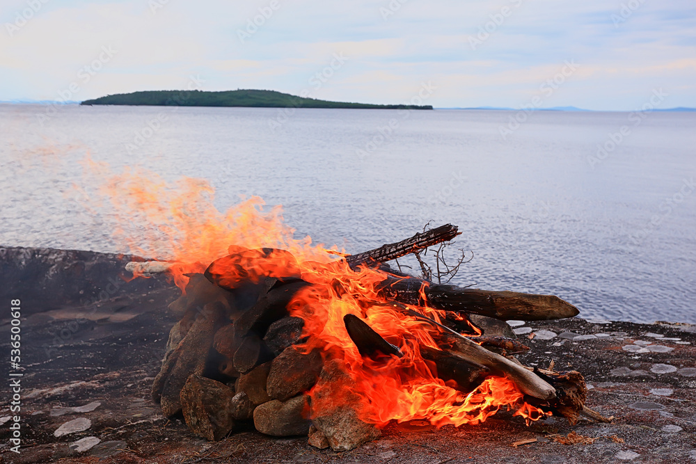 Naklejka premium bonfire on the lake shore tourism motivation