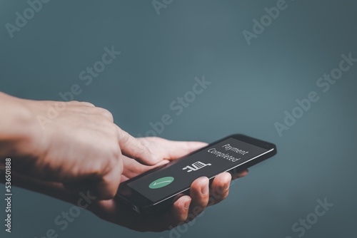 Wallpaper Mural Young man using Electronic payment  on mobile phone, Customer holding smartphone and making digital payment transaction. Torontodigital.ca