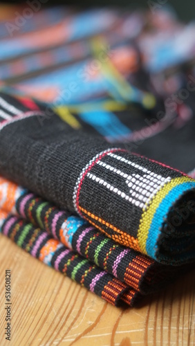 Pile of woven fabrics from East Nusa Tenggara Indonesia © Dennis
