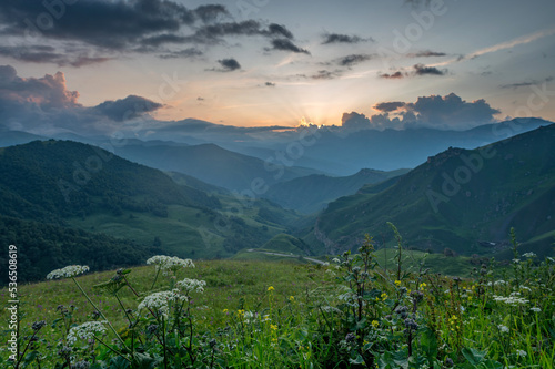 Scenic mountain sunrise landscape in mountains of Caucasus photo