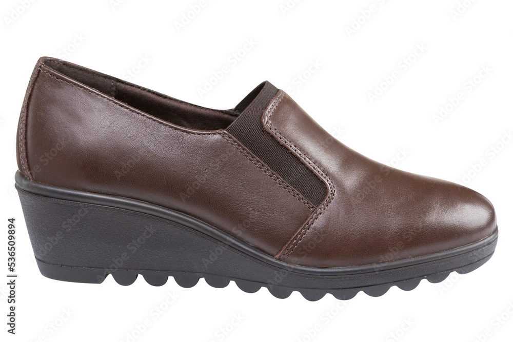 Brown leather women's shoes, wedge sole with protector, on a white background, isolate Brown leather women's shoes, wedge sole with protector, on a white background, isolate