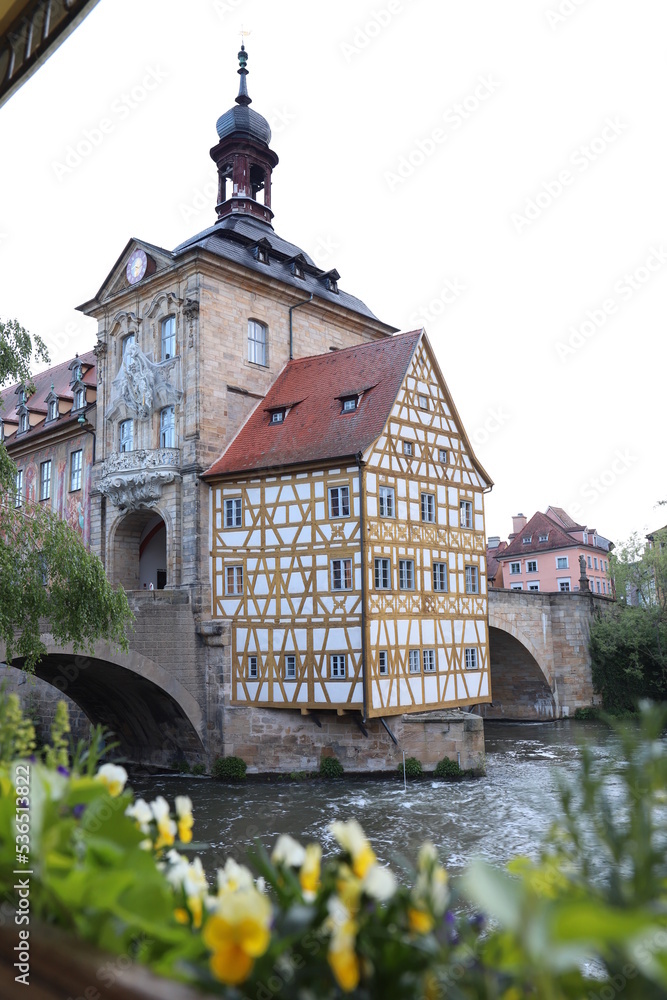 Bridge wheel house in Babmberg north Bavaria. Historical and special half-timbered building in the morning in Germany at the Regnitz river