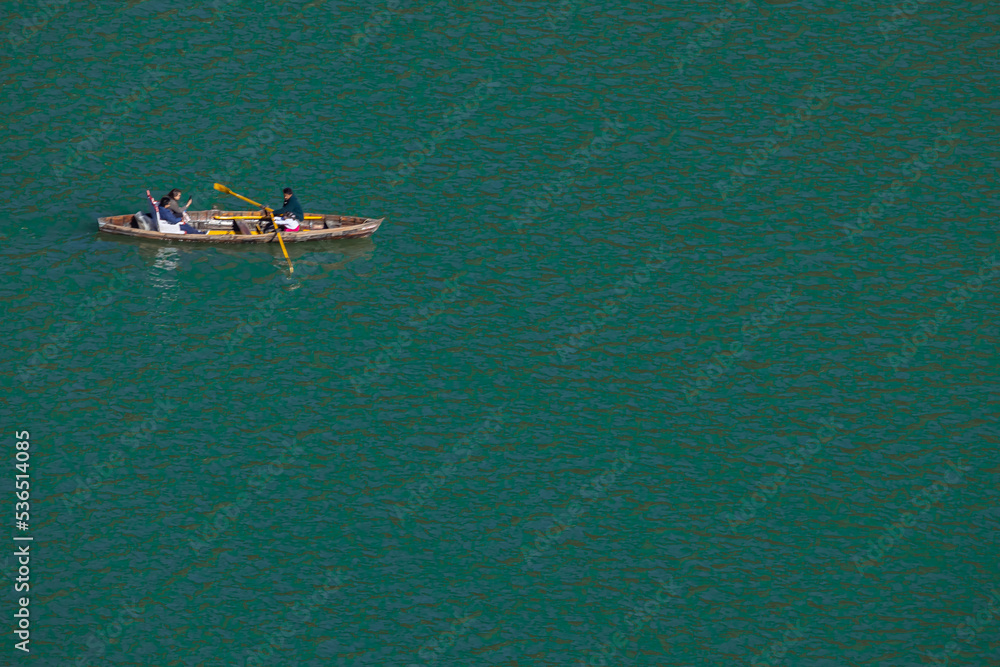 Naklejka premium Selective focus Ariel view of people boating at Naini Lake in Nainital Uttarakhand India on 2 January 2022
