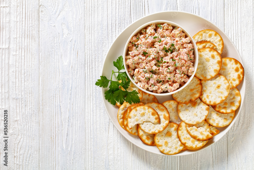 classic ham salad with crackers on white plate classic ham salad with crackers on white plate