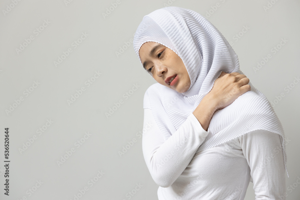 Muslim woman having shoulder or neck pain Muslim woman having shoulder or neck pain