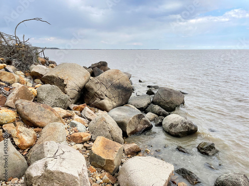 Rocky section of the shore of Lake Khanka in autumn. Russia, Primorsky Krai photo