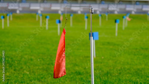 red wind direction flag biathlon shooting range. outdoor in the summer. photo