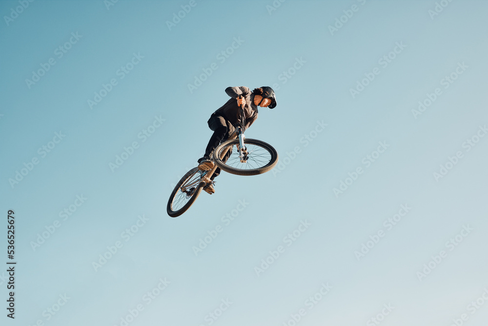 Motorcycle stunt, man cycling in air jump on blue sky mock up for sports action performance, fitness training or outdoor bike performance. Professional sports person with bmx bicycle adventure mockup Motorcycle stunt, man cycling in air jump on blue sky mock up for sports action performance, fitness training or outdoor bike performance. Professional sports person with bmx bicycle adventure mockup