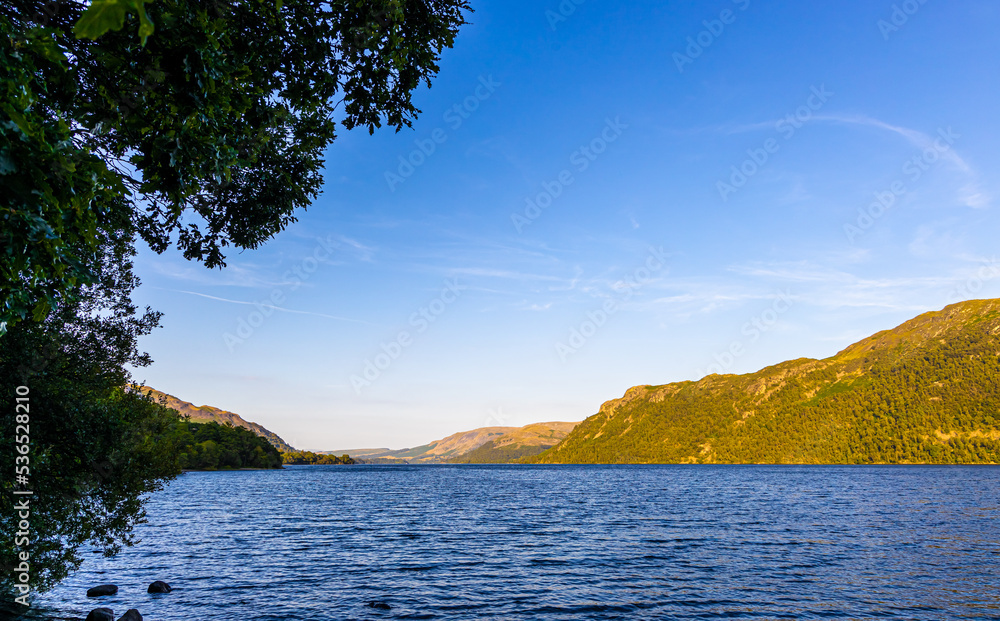 Sunset over Ullswater lake in Lake District, a region and national park in Cumbria in northwest England