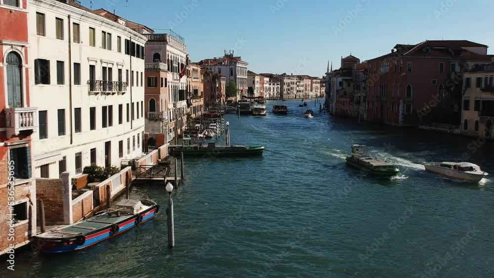 Aerial view of street water canal busy bridge near Venice. drone panorama city overlooking the canal the Adriatic Sea in northern Italy. A shot of people walking across the bridge from a drone. Sunset Aerial view of street water canal busy bridge near Venice. drone panorama city overlooking the canal the Adriatic Sea in northern Italy. A shot of people walking across the bridge from a drone. Sunset
