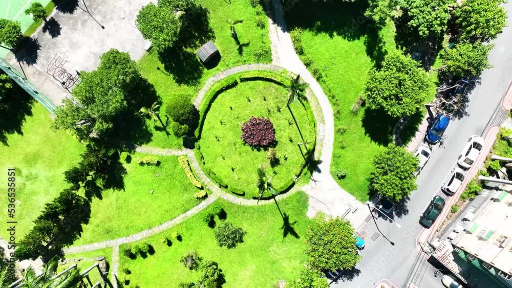 4K shot ascent circle ariel view :  flower bed plants park modern lanscape design famous landmark soigne garden plants pattern and outdoor tennis court in apartment building complex ,Taiwan Asia