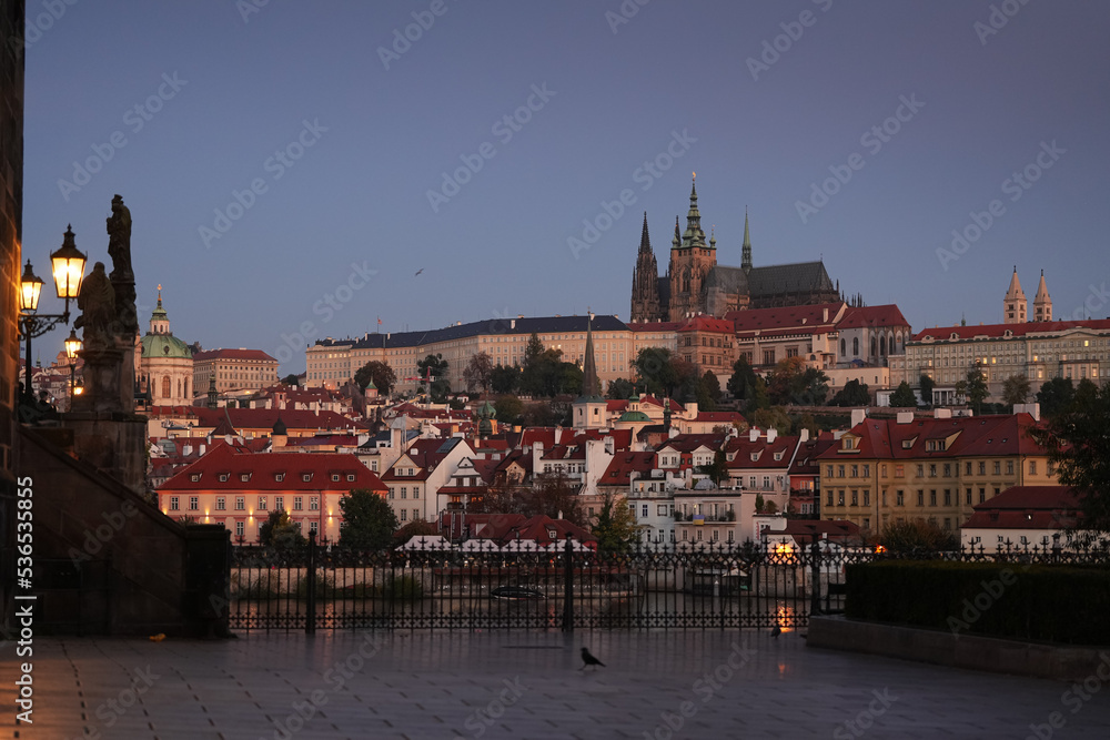 Travel to Czech Republic. Cityscape in the blue hour with a view from Charles Bridge to Prague Castle landmark buildings.