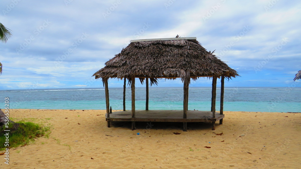 A traditional beach hut on the island of Samoa in the pacific ocean 