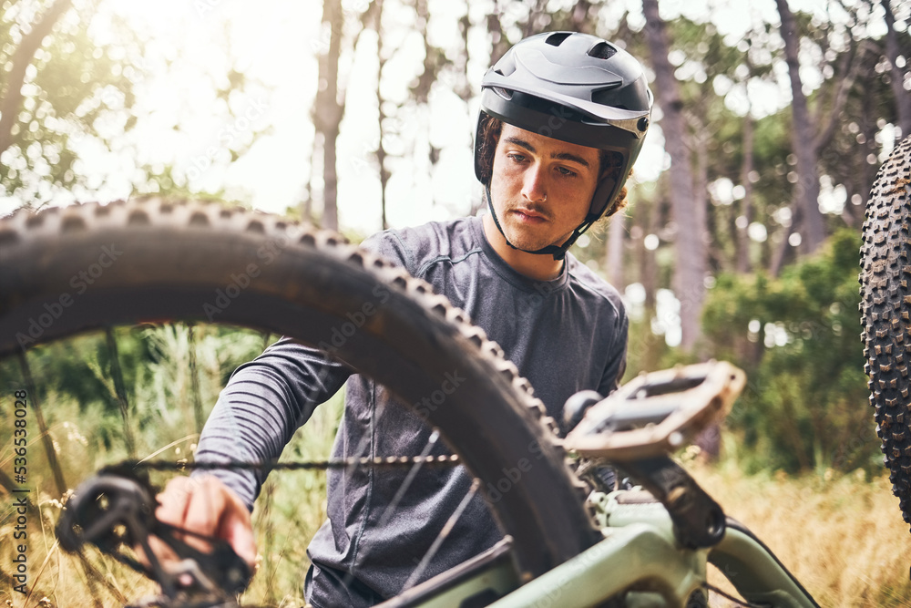 Mountain bike, fitness or cyclist fixing chain in exercise, training or workout in Norway forest or nature woods. Thinking man, bicycle or sports athlete and helmet or motivation in equipment repair Mountain bike, fitness or cyclist fixing chain in exercise, training or workout in Norway forest or nature woods. Thinking man, bicycle or sports athlete and helmet or motivation in equipment repair