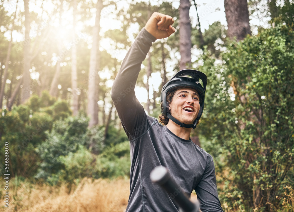 Fototapeta premium Mountain bike man celebrate achievement, success and goal in forest, woods or Norway park cycling race competition winner. Happy, excited and pride bicycle athlete freedom, energy and fist motivation