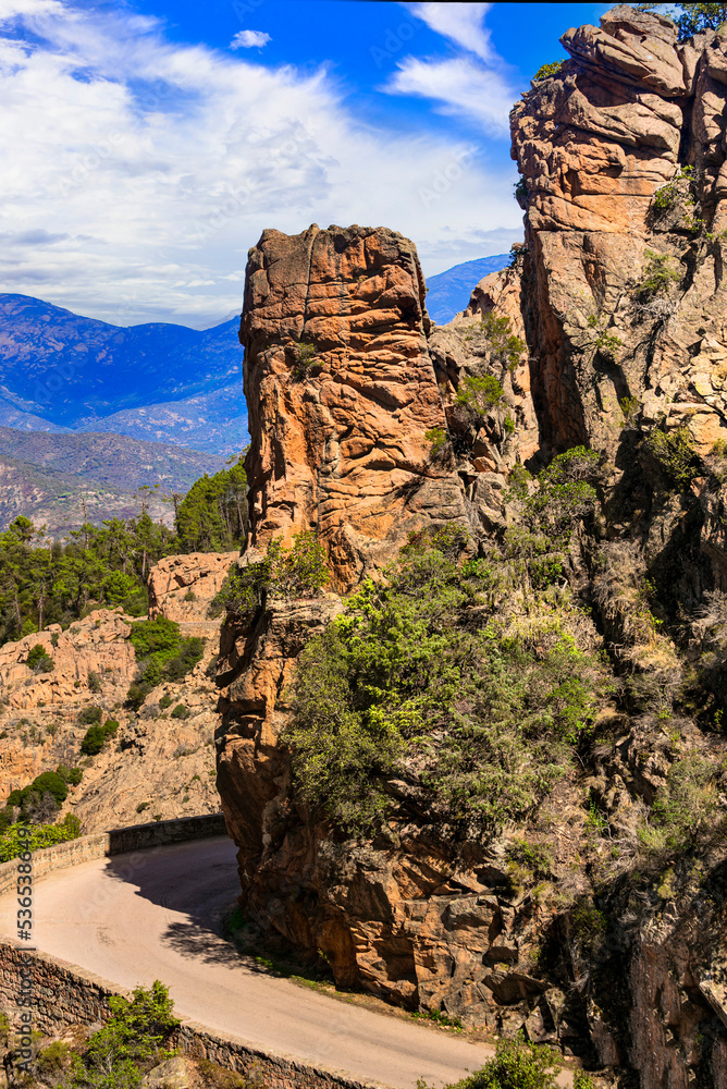 Naklejka premium Corsica, France. Amazing red rocks of Calanques de Piana. famous route and travel destination in west coast of the island in gulf of Porto.