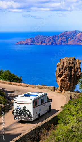 Corsica isalnd senery, road travel by camper. Famous national park Calanques de Piana, with stunning red rocks photo