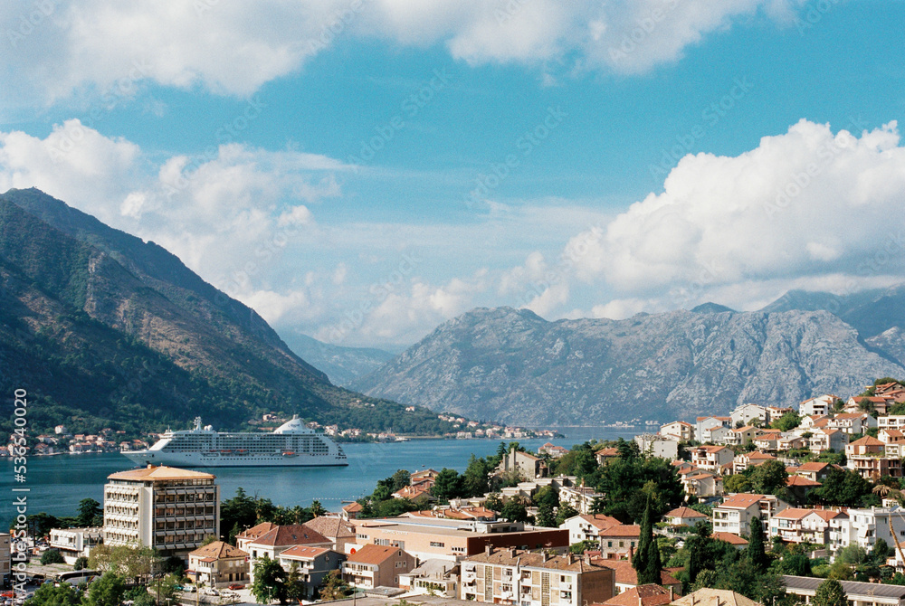 White cruise ship sails along the Bay of Kotor. Montenegro