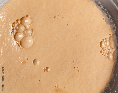 Εκτύπωση καμβά fermenting bread yeast from above close up bubbles