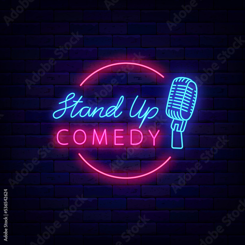 Stand up comedy neon signboard. Circle frame with microphone. Comic night. Light sign. Vector stock illustration